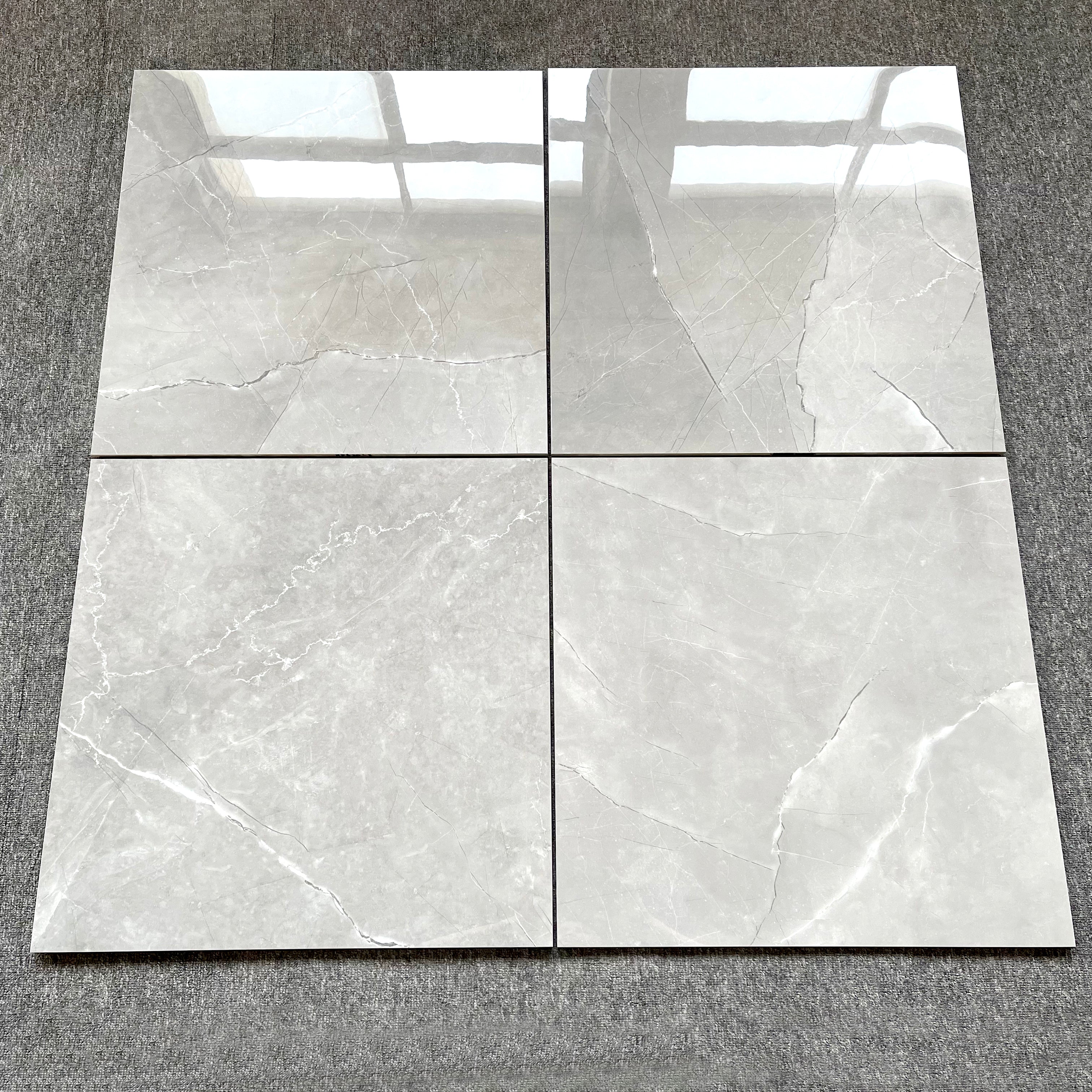 $11.900 por m²<br>Porcelanato Mármol Titanio Brillante 60x60<br>Caja de 1.44 m²
